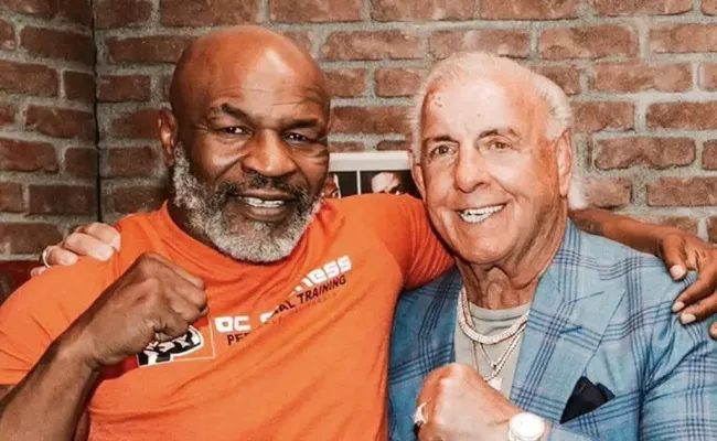 Mike Tyson poses in a photo with wrestling legend Ric Flair. (Source: Instagram)