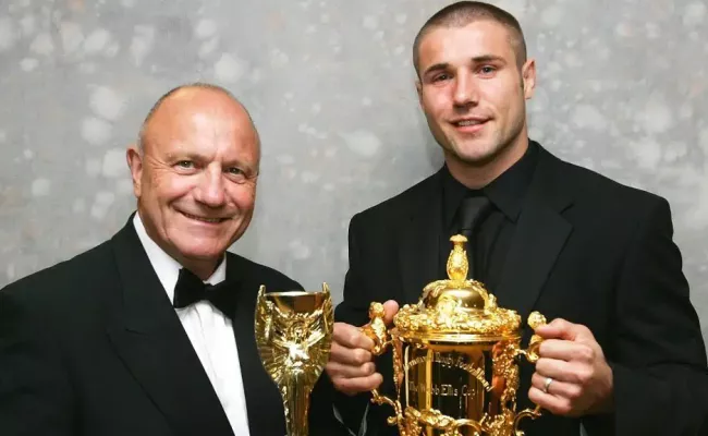 George and Ben pose together with the football and rugby World Cups – which they both won(Source:TheSun)