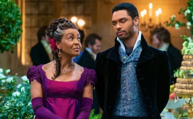 Lady Danbury, portrayed by Adjoa Andoh, and Duke Simon Basset, played by Regé-Jean Page, in the second season of Bridgerton. (Source: thefamilynation.com)