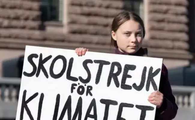 Greta Thunberg holding the sigh that says, “School Strike For Climate”. (Source: applied behavior analysis programs)