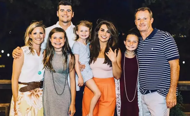 Jason Stidham, his then-fiancée Kennedy Brown (in orange pants) and the Copelands. (Source: Sports Illustrated)
