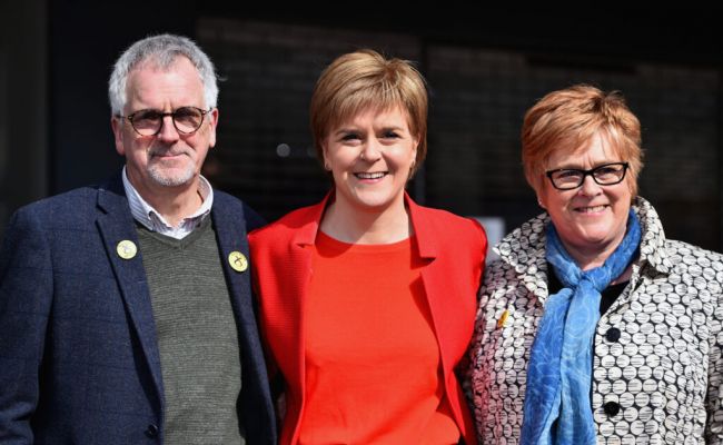 Nicola Sturgeon in 2016, pictured with her parents, Robin and Joan. (Image Source: STV News)