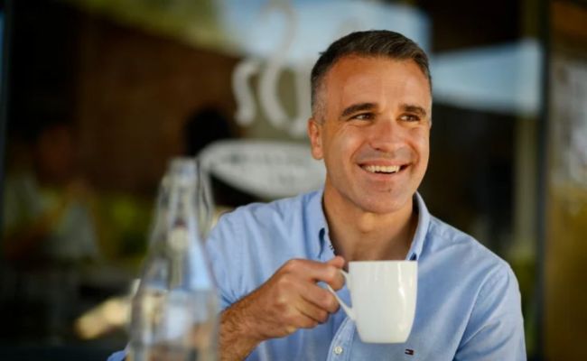 Peter Malinauskas, the premier of South Australia, photographed in his neighborhood Queen Street Cafe. (Source: Sydney Morning Herald)